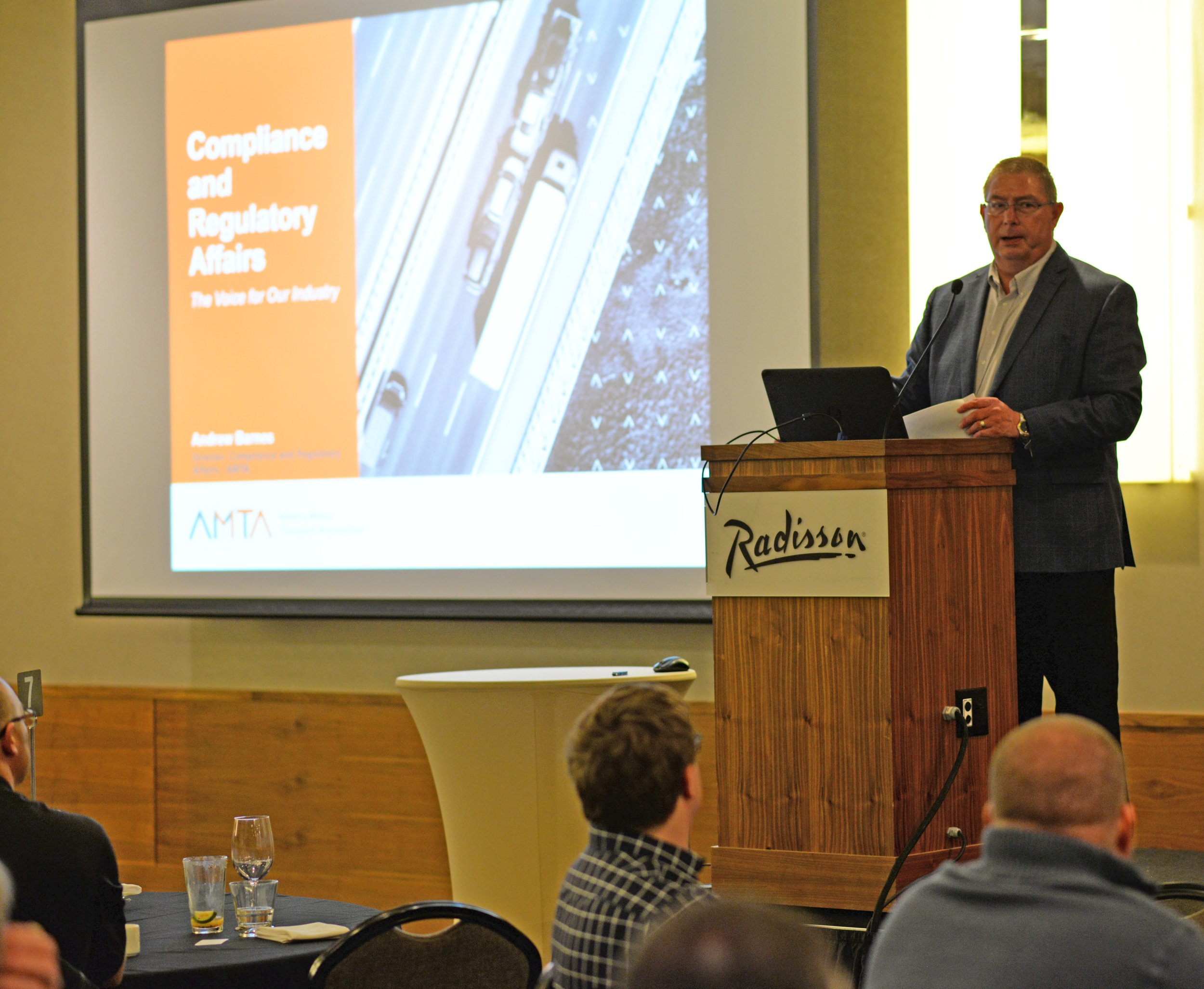 host is hosting an event compliance and regulatory affairs on the stage