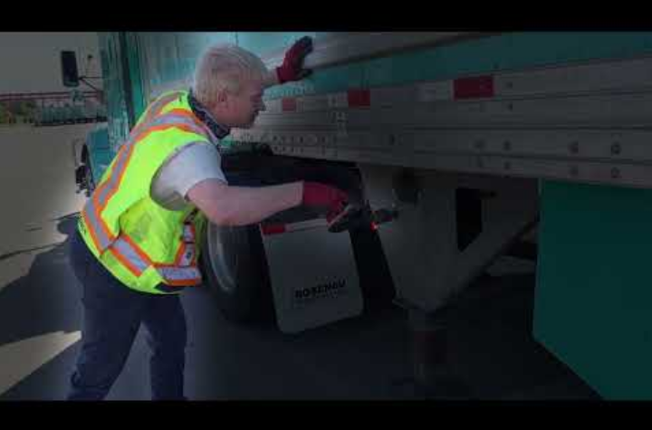 truck driver securing a shipment