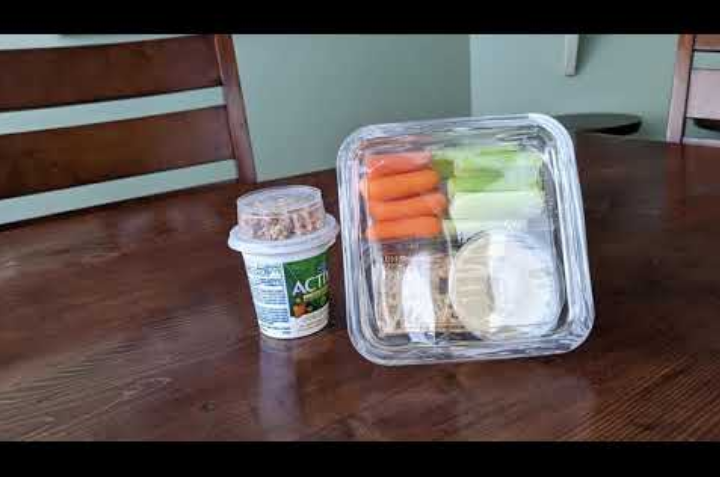 Truck driver healthy lunch example of vegetables, dip, crackers, yogurt, and granola