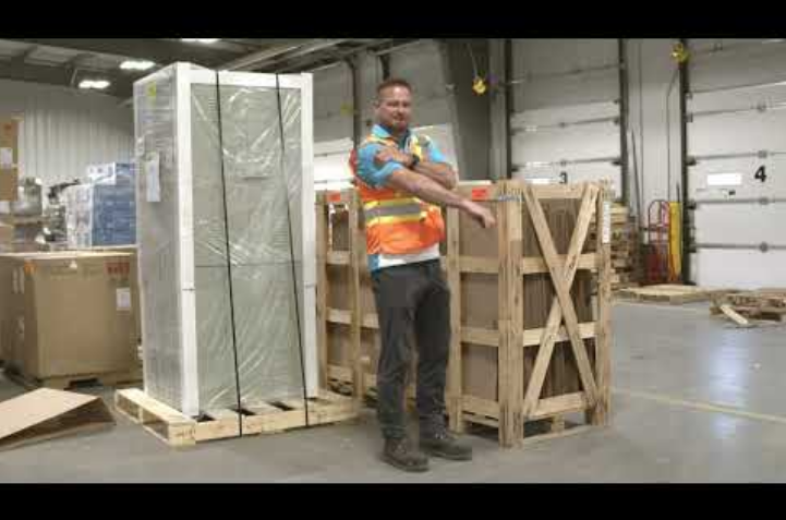 Warehouse employee stretching their shoulder