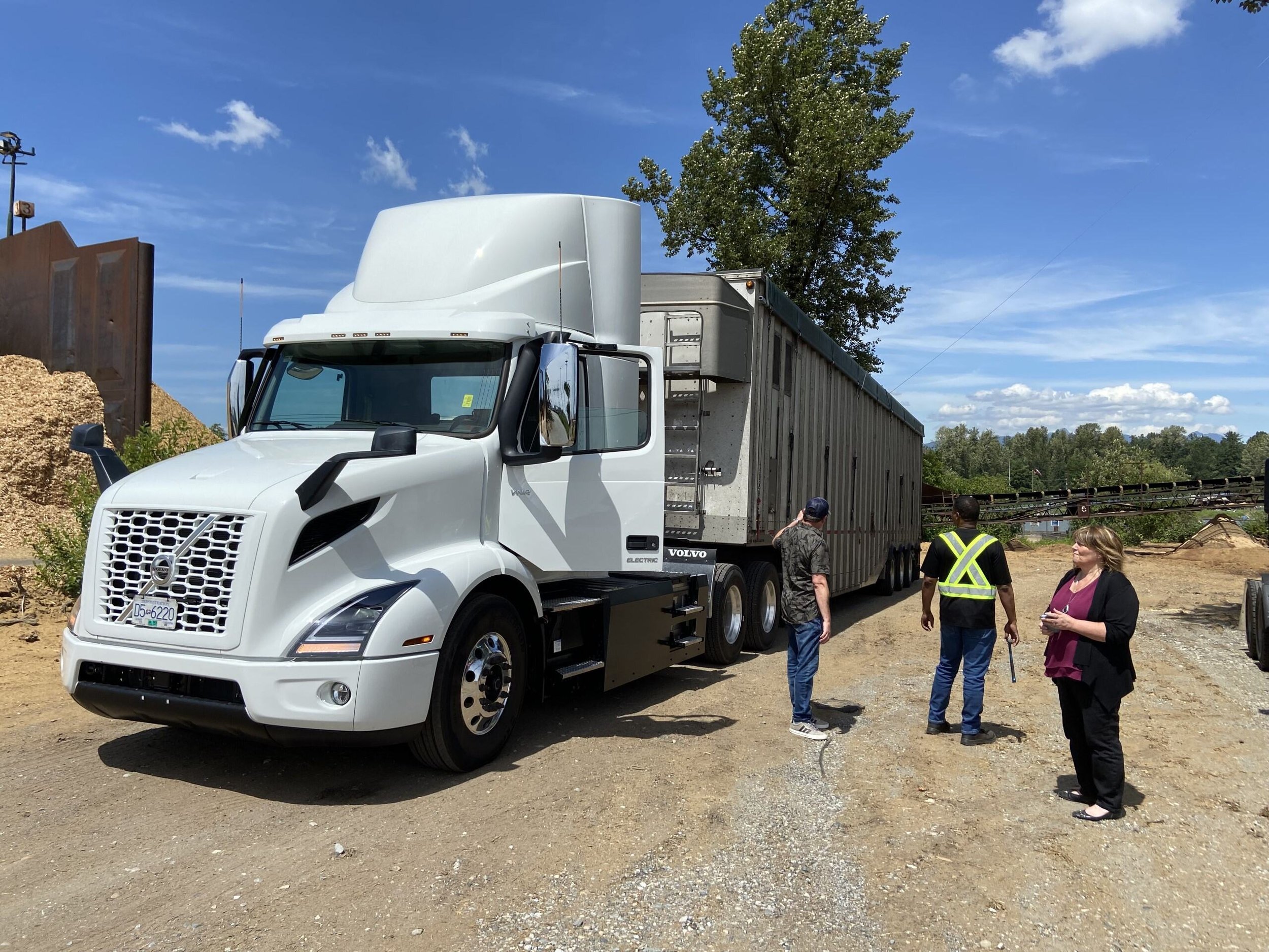 ZETT Truck on a sunny day with three employees wearing safety vests