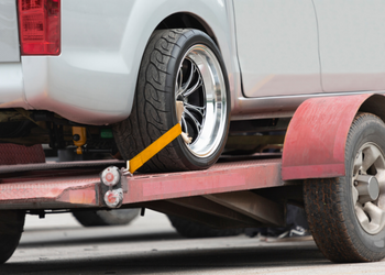Close-up of vehicle towed on a trailer